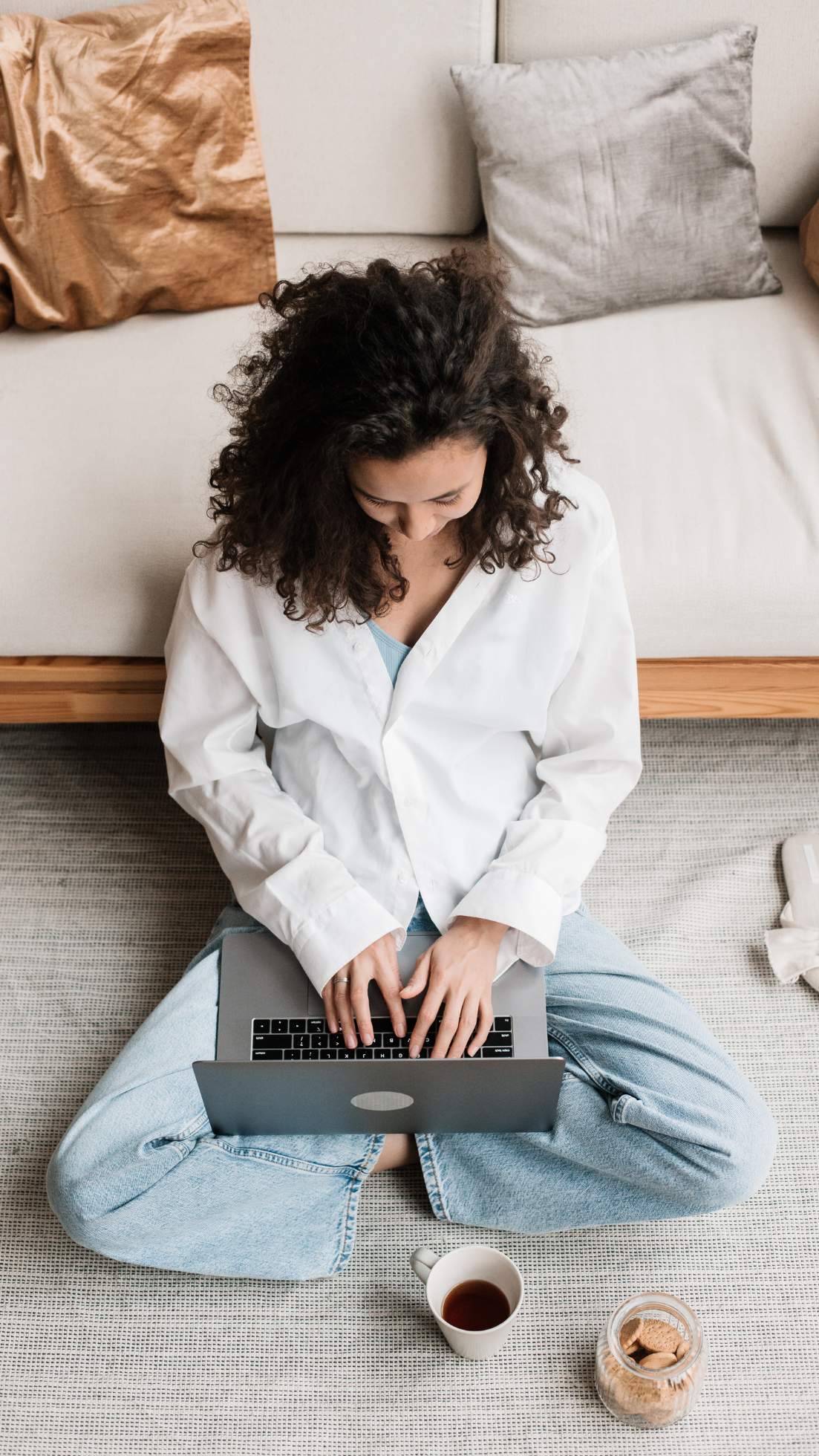 woman on floor on laptop